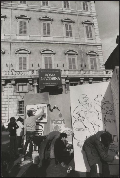 Artists painting murals on freestanding panels in Piazza San Pantaleo in Rome that advise against speculation in the trade markets, and were organised by the PCI (Partito Communista Italiano)