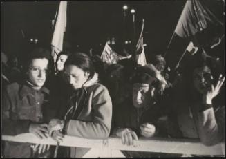People waiting, pressed up against barriers, for the announcement of election results