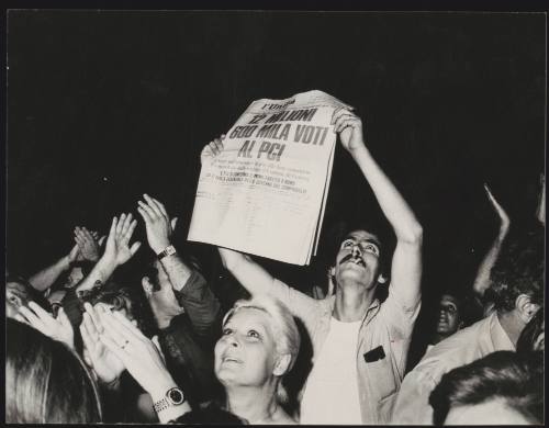 A man holds up a copy of 'L'Unita' whose headline reads - '12 million 600 thousand votes to PCI', dated 23rd June 1976