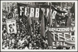Large crowds gather at a Communist Party rally, including members of the trade union CGIL