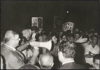 A demonstration held by young Communists with placard referencing imprisoned Padrut Franco and counterculture symbol Che Guevara