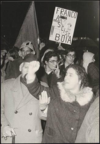 Protesters, including one holding a placard with an anti Franco slogan, at an anti fascist protest
