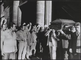 Pallbearers carrying the coffin of Pietro Secchia before a crowd of Italian Communist Party supporters