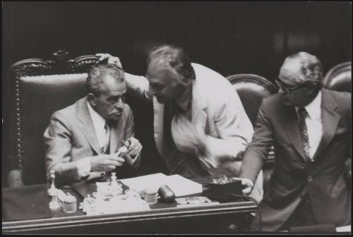 Marco Pannella leans over to talk to Pietro Ingrao, the President of the Italian Chamber of Deputies. Antonio Maccanico looks on