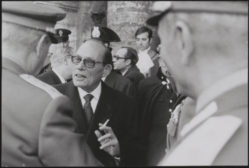 Portrait of a politician greeting Generals