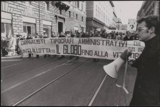 Journalists and typographers march at a demonstration to save the newspaper 'Il Globo' 