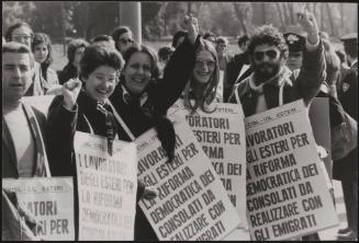 A line of workers from the Ministry of Foreign Affairs wearing placards demanding workers rights for foreign workers 