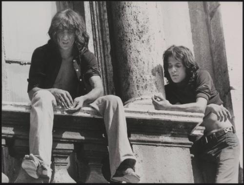 Protesters who have scaled St. Peter's Basilica in the Vatican City watch the response below