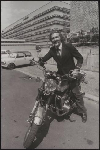 Actor Federico Martignoni about to collect club owner Paolo Vassallo on a motorbike during the Number One night club drugs scandal

