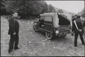 Policemen deal with the aftermath of a gun battle with neo-fascists on L ' Rascino Plateau in which right-wing extremist Giancarlo Esposti was shot dead