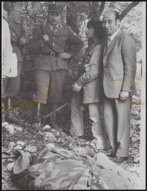 Policemen arrest Alessandro D'Intino in the aftermath of a gun battle with neo-fascists on L' Rascino Plateau in which right-wing extremist Giancarlo Esposti was shot dead