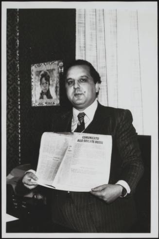 Giovanni Furfano holds up a Red Brigades press statement