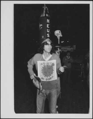 A young man attends a anti Nuclear protest