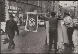 Men holding a Swastika flag in a protest against the pope during the divorce law referendum, Rome