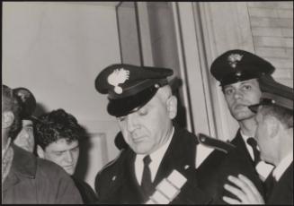 Raphael Minichiello, planejacker, being led away by Carabinieri in court