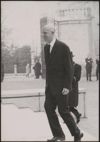 A minister arriving to meet British Prime Minister Harold Macmillan