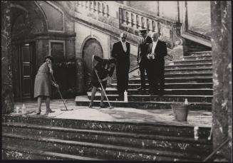 Guards and staff inspect cleaning work on the Egmont Palace grand stairs before the visit of British Prime Minister Harold Macmillan
