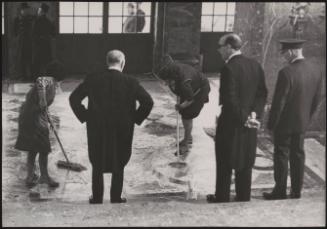 Guards and staff inspect cleaning work on the Egmont Palace grand stairs before the visit of British Prime Minister Harold Macmillan