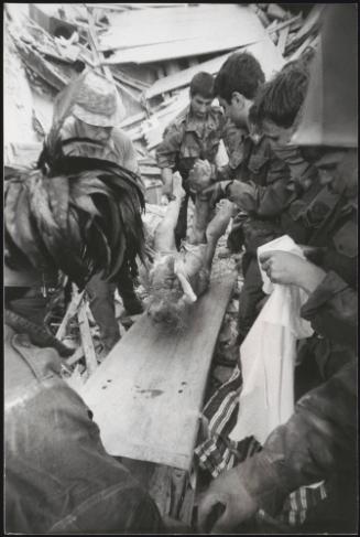 A victim is carried out of the destruction of the Friuli earthquake