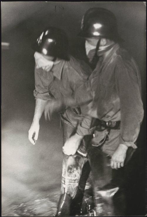 Firemen with masks following the Belice earthquake in Sicily, 1968