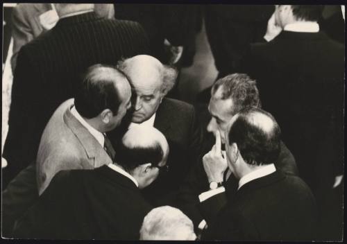 A huddle of politicians including Aldo Moro, Giovanni Galloni and Carlo Donat-Cattin in parliament
