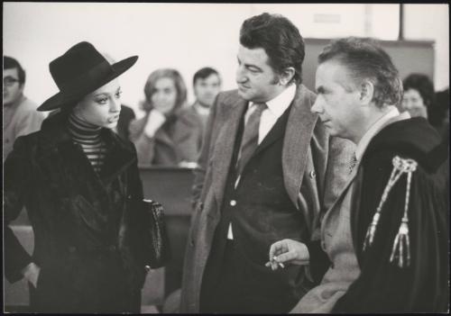 Politician Loris Fortuna watches as a woman confronts a lawyer