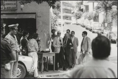 Police gather on the street corner where Magistrate Vittorio Occorsio was murdered