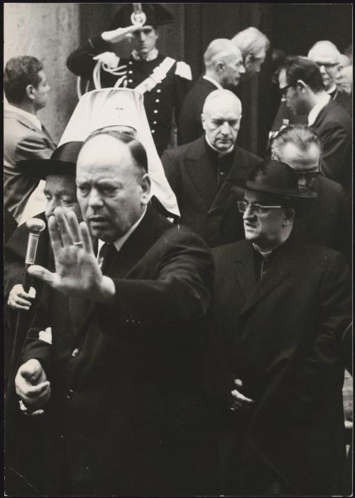 Cardinal Alfredo Ottaviani leaving a building.