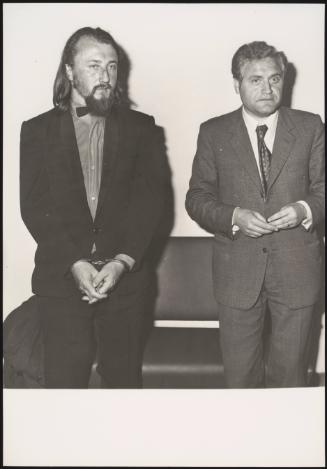 Laszlo Toth stands handcuffed next to his lawyer, after attacking and damaging La Pieta sculpture.