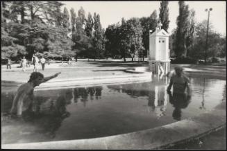 Two 'bathers' in the fountain of the Triennale gardens in Milan's Sempione Park, part of Giorgio de Chirico's sculptural installation in the park 'Mysterious Baths Fountain'