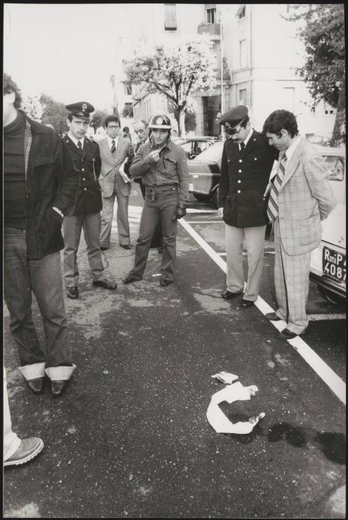 Policemen gathered at the spot where Publio Fiori was ambushed and shot by members of the Red Brigades