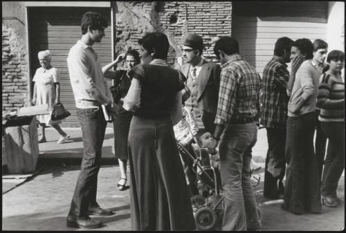 Young men, women, children and adults congregate on the streets in Rome where the Jewish Ghetto once stood