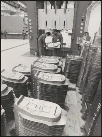 Two men at work on the factory floor in the Honda factory in Chieti, Italy
