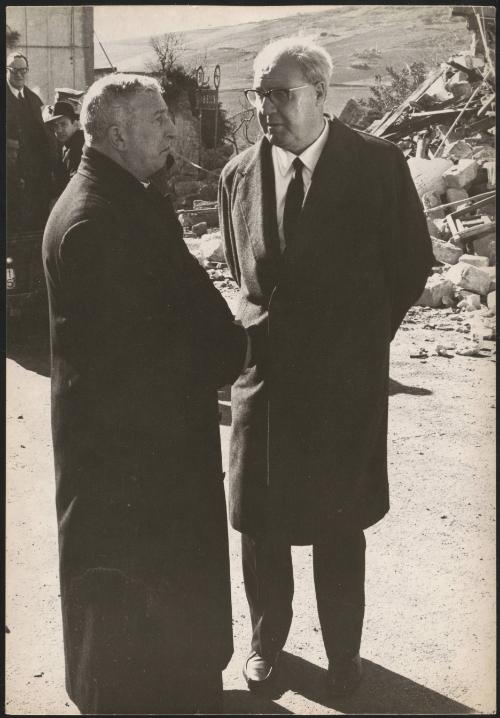 President of the Republic Joseph Saragat and the interior minister Paolo Emilio Taviani stand by the destruction form the aftermath of the 1968 Belice earthquake in Sicily