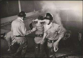 Firefighters around a staircase putting out a blaze after the Belice earthquake, 1968, Sicily