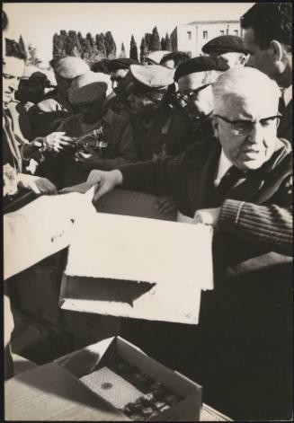 Rations and supplies are handed out to the displaced civilians in the aftermath of the Belice earthquake in Sicily 1968