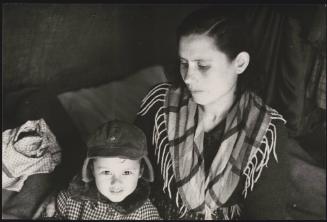 A mother and her child in their temporary shelter in the aftermath of the Belice earthquake, Sicily 1968