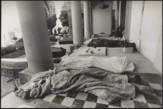 Bodies of the victims from the Friuli earthquake in 1976, are lined up outside a building ready to be put into coffins in Osoppo cemetery 