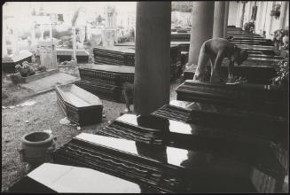Coffins line the edge of the cemetery after the Friuli earthquake claimed the lives of 939 people