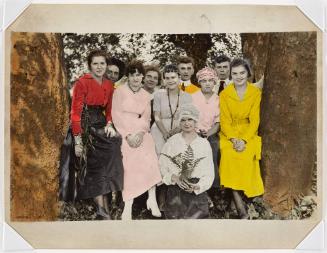 A group of ten men and women between trees