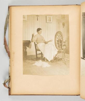 [Woman at her spinning wheel] [Page 43 of Quebec I; from collection of Canadian albums compiled by Edith S. Watson, 1890s-1930s.]