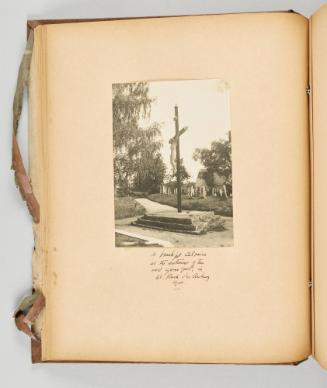 A beautiful calvaire at the entrance of the old graveyard, in St. Roch des Aulnaies, Que. [Page 26 of Quebec I; from collection of Canadian albums compiled by Edith S. Watson, 1890s-1930s]