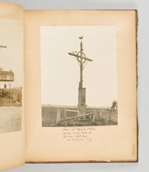 Crosses and wayside shrines mark every mile of Quebec highways. At Varennes, P.Q. [Page 19 of Quebec I; from collection of Canadian albums compiled by Edith S. Watson, 1890s-1930s]