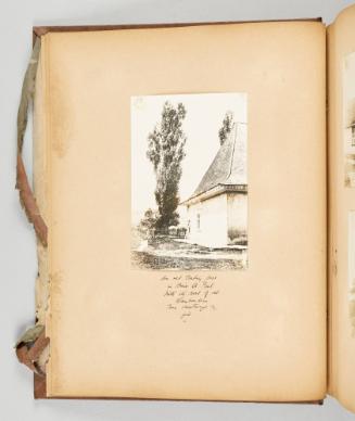 An old trading post in Baie St. Paul, with its row of red Lombardies, was destroyed by fire. [Page 8 of Quebec I; from collection of Canadian albums compiled by Edith S. Watson, 1890s-1930s]