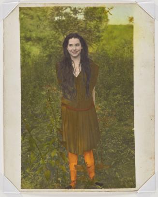 A young woman with long hair wearing orange stockings