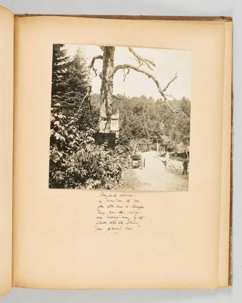 Wayside shrine, on road over the rut from Ste. Anne de Beaupre. Every year this bridge was carried away by the floods, until the shrine was placed here! Page 37 of Quebec II; from collection of Canadian albums compiled by Edith S. Watson, 1890s-1930s
