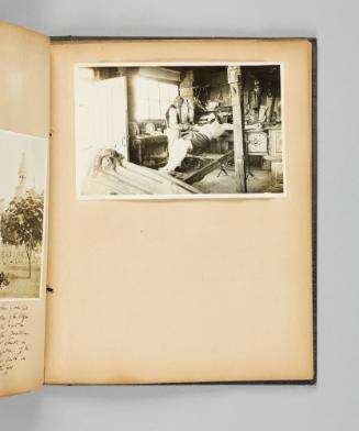 [Jobin in his workshop with a large statue of Christ on the Crucifix] Page 69 of Ste Anne de Beaupré; from collection of Canadian albums compiled by Edith S. Watson, 1890s-1930s