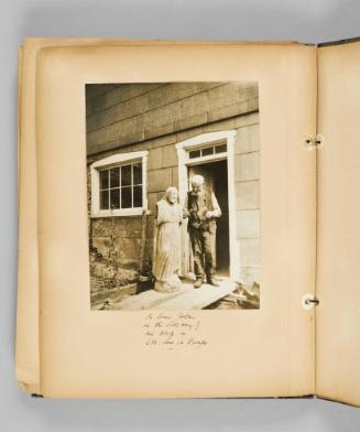 Mr. Louis Jobin in the doorway of his shop in Ste. Anne de Beaupré. Page 56 of Ste Anne de Beaupré; from collection of Canadian albums compiled by Edith S. Watson, 1890s-1930s