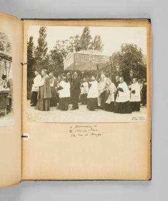 A procession in the Church Park, Ste. Anne de Beaupré. Page 53 of Ste Anne de Beaupré; from collection of Canadian albums compiled by Edith S. Watson, 1890s-1930s
