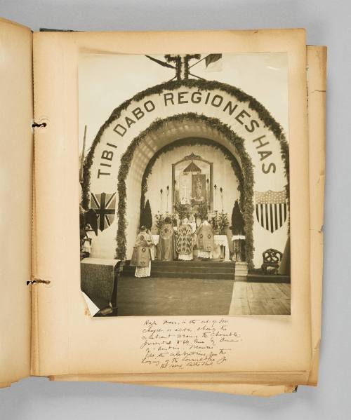 High Mass, in the out-of-door chapel, or altar, showing the celebrant wearing the chasuble presented to Ste. Anne by Anne-of-Austria, France. At the celebration of the laying of the Cornerstone of the new catherdral. Page 43 of Ste Anne de Beaupré; from collection of Canadian albums compiled by Edith S. Watson, 1890s-1930s